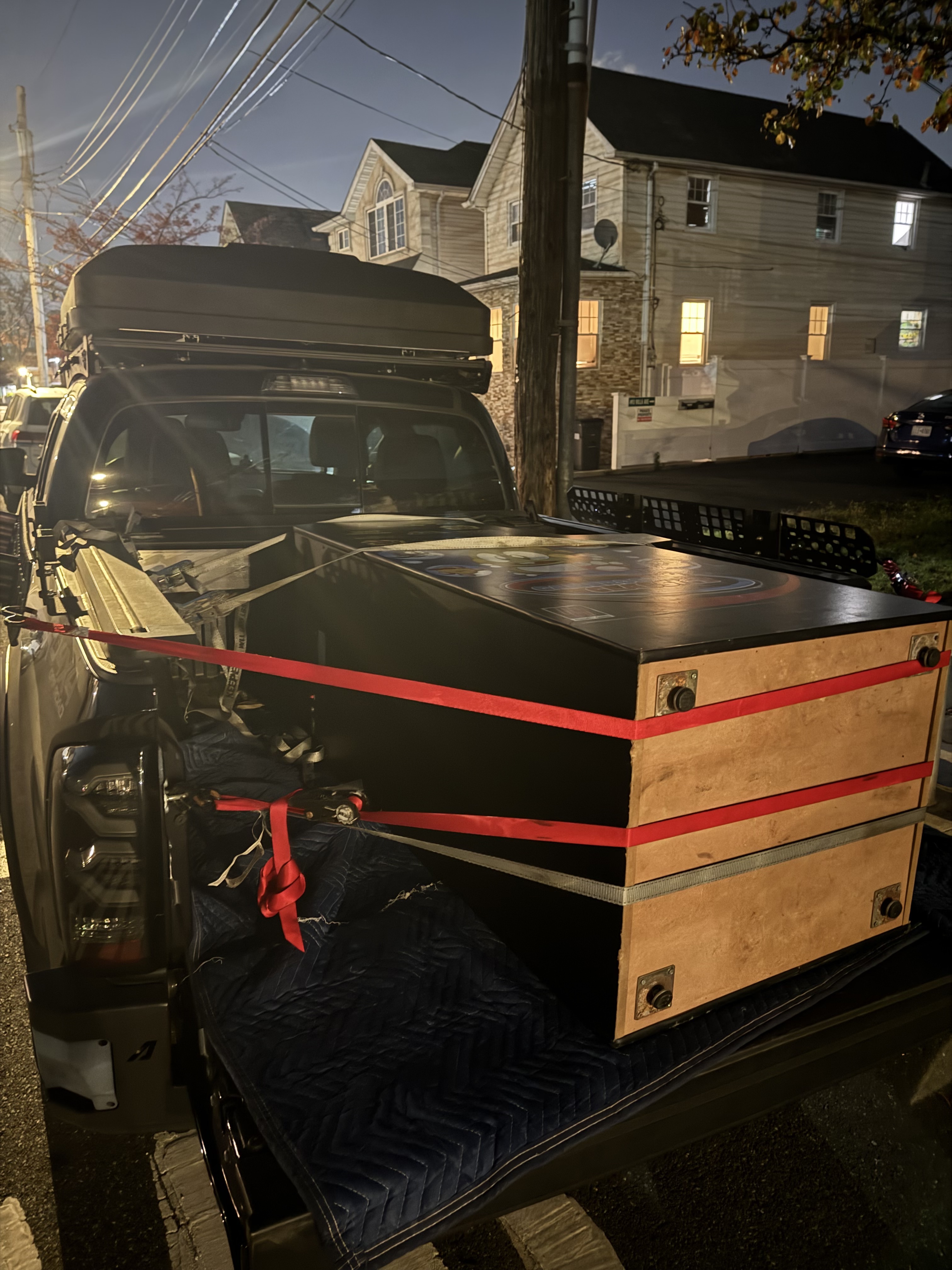 Bringing the arcade cabinet from Staten Island, strapped into the back of a truck